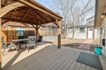 Deck with gazebo for outdoor dining, fenced backyard